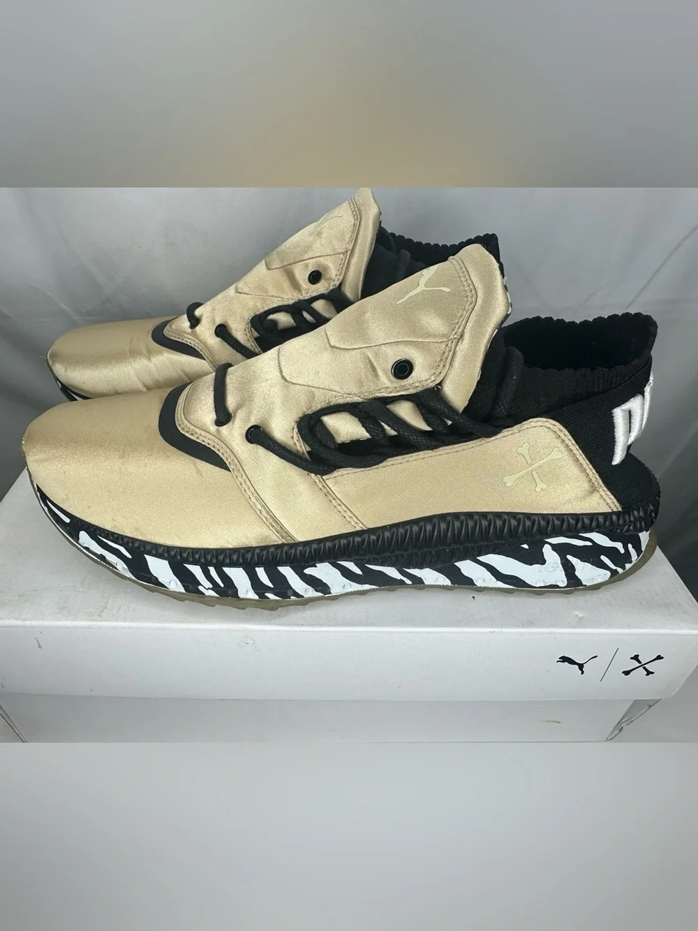 Puma Metallic Gold Sneakers with Black Details